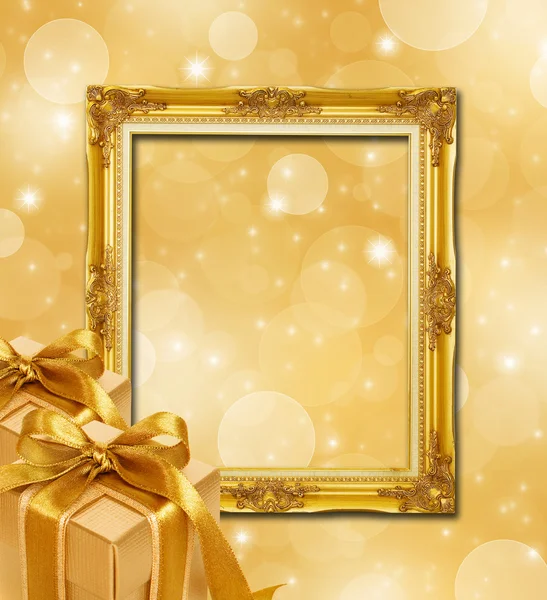 Abstraktes Gold Weihnachten Hintergrund mit Rahmen und Gold-Geschenk-Box — Stockfoto