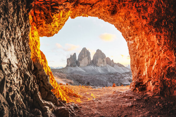 Tre Cime Di Lavaredo peaks in incredible orange sunset light