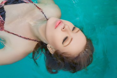 Young woman beauty portrait in water clipart
