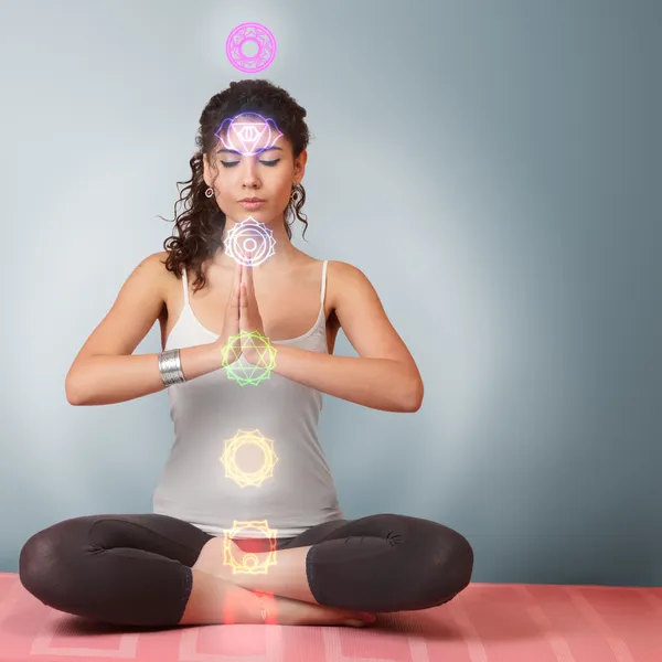 Beautiful young woman doing yoga exercise — Stock Photo, Image