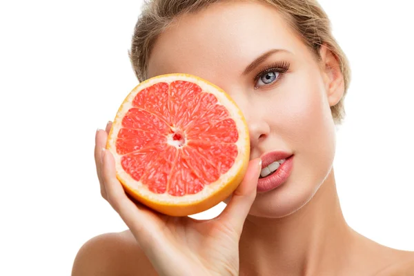 Young woman with orange in her hands — Stock Photo, Image