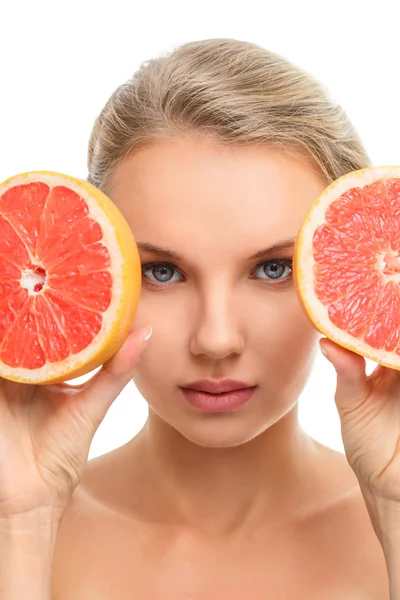 Young woman with orange in her hands — Stock Photo, Image