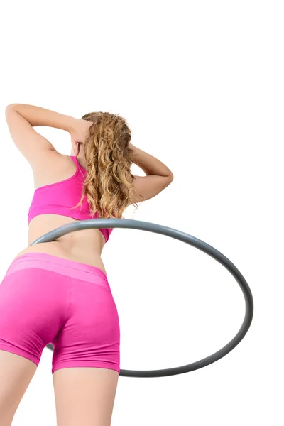 Mladá žena rotující hula hoop — Stock fotografie