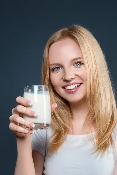 Young woman with milk Royalty Free Stock Images