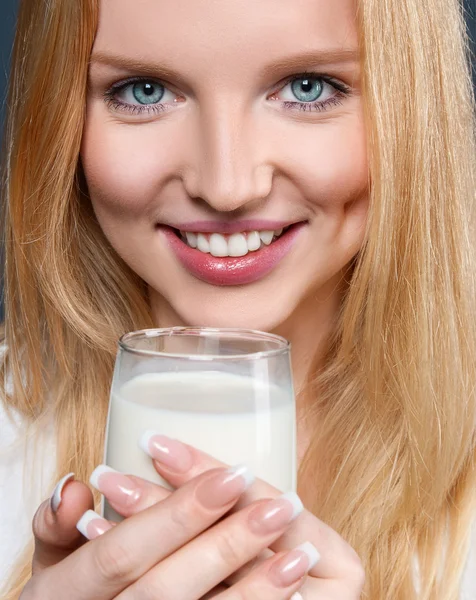 Young woman with milk Stock Picture