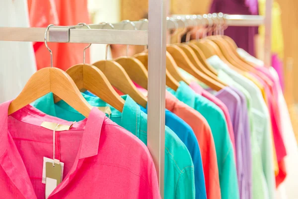 Fashion clothing on hangers — Stock Photo, Image