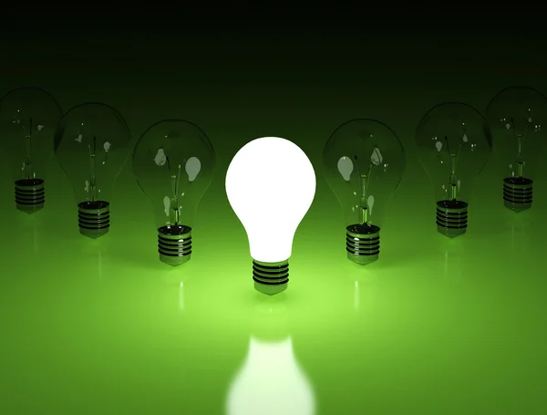 Row of light bulbs on green background — Stock Photo, Image