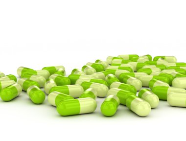 Green pills on white background clipart