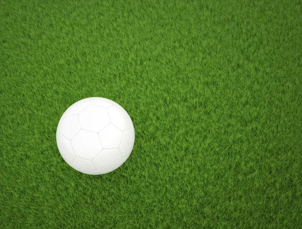 Soccer ball on green grass top view — Stock Photo, Image