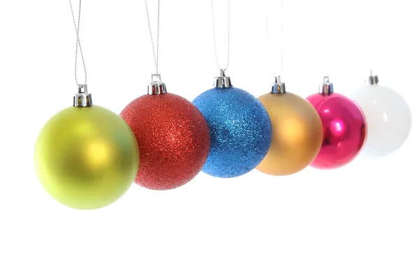 Multiple hanging Christmas ball on white background. — Stock Photo, Image