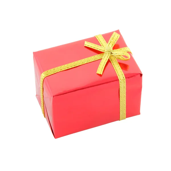 Red gift box and golden ribbon on white background. — Stock Photo, Image
