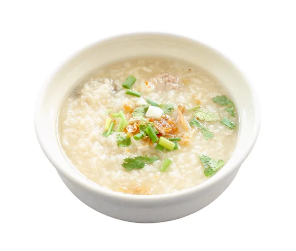 Asya congee yuvarlak kase beyaz zemin üzerine.