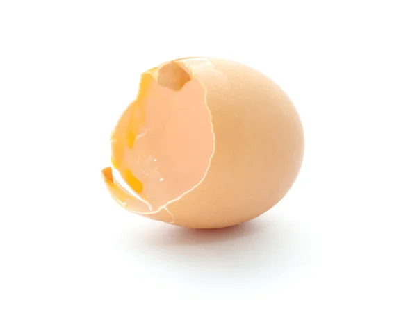 Part of eggshell broken on white floor. — Stock Photo, Image