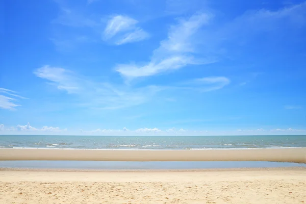 Empty tropical sea beach with some cloud in sunny day.