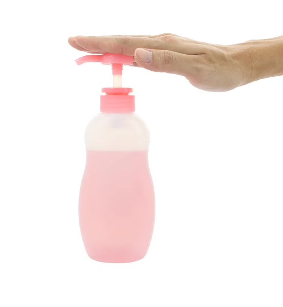Hand push bottle pump on white background. — Stock Photo, Image