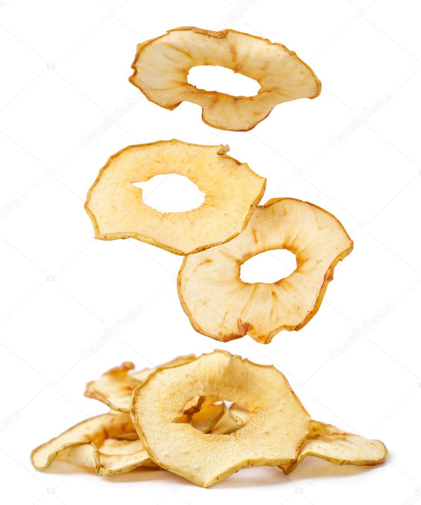 Apple chips are falling on a heap close-up on a white background. Isolated