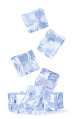 Ice cubes fall on a pile close-up on a white background. isolated