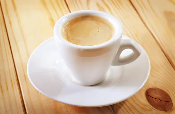 Fresh coffee in cup — Stock Photo, Image