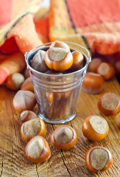 Hazelnuts on old wooden table — Stock Photo, Image