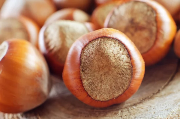 Hazelnuts on old wooden table — Stock Photo, Image