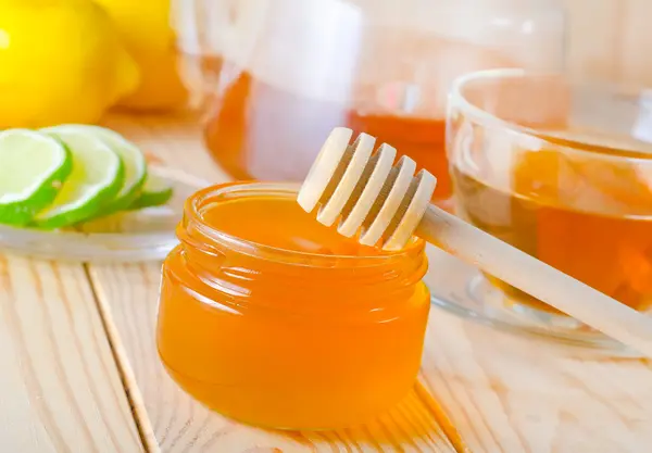 Honey in glass bank — Stock Photo, Image