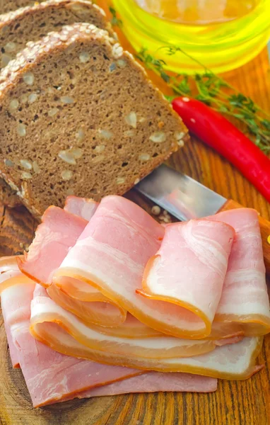 Bacon and bread — Stock Photo, Image