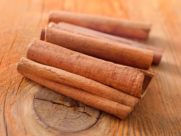 Cinnamon on a wooden table — Stock Photo, Image