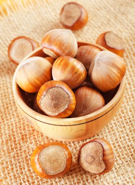 Hazelnuts in a wooden bowl — Stock Photo, Image