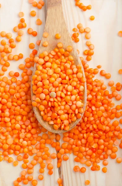 Red lentil in the spoon — Stock Photo, Image