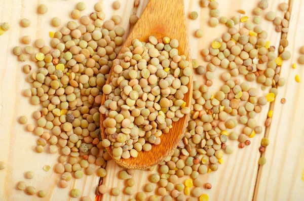 Peas in a spoon — Stock Photo, Image