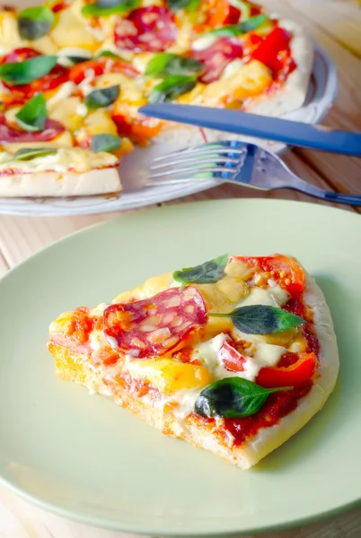 Fresh pizza with basil — Stock Photo, Image