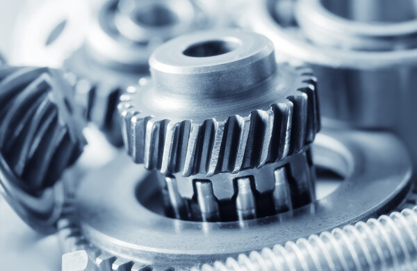 Industrial gear machinery, engineering parts in blue toning