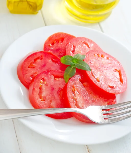 Tomato with basil — Stock Photo, Image