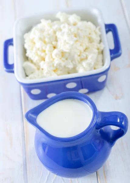 Milk in blue jug — Stock Photo, Image