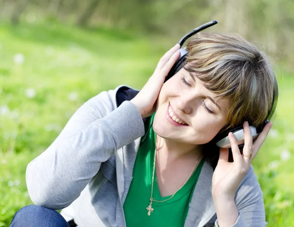 Young woman with headphones — Stock Photo, Image