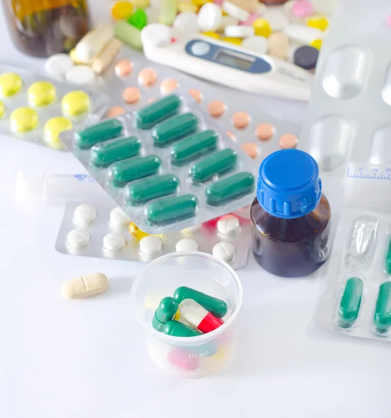 Color pills and medical bottle — Stock Photo, Image