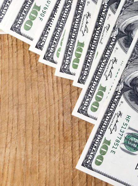 Dollars on wood — Stock Photo, Image