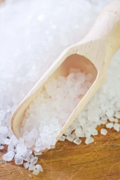 Salt in a wooden scapula — Stock Photo, Image