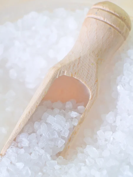 Salt in a wooden scapula — Stock Photo, Image