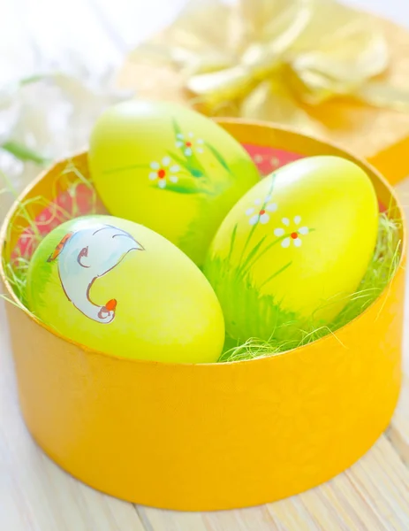 Easter eggs in yellow box — Stock Photo, Image