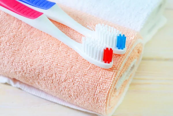 Toothbrushes on the towel — Stock Photo, Image