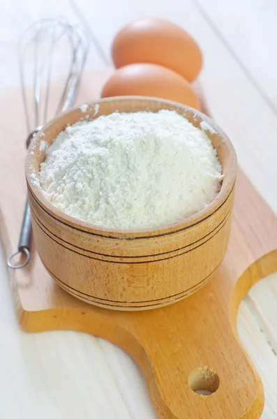 Flour in a wooden bowl — Stock Photo, Image
