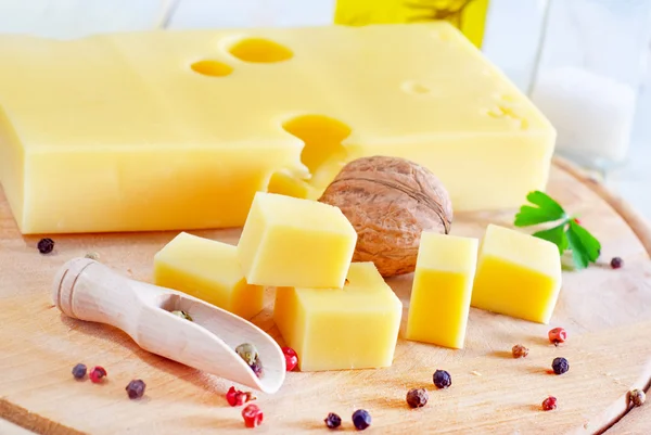 Cheese on a wooden board — Stock Photo, Image