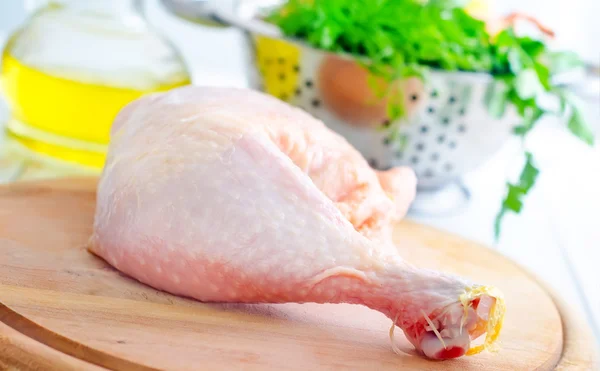 Raw chicken and knife on the wooden board — Stock Photo, Image