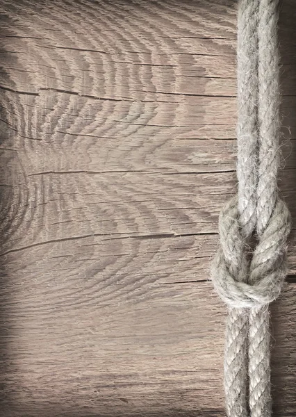 木制背景上的绳子 — 图库照片