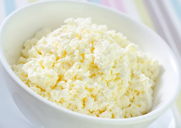 Cottage cheese in white bowl — Stock Photo, Image