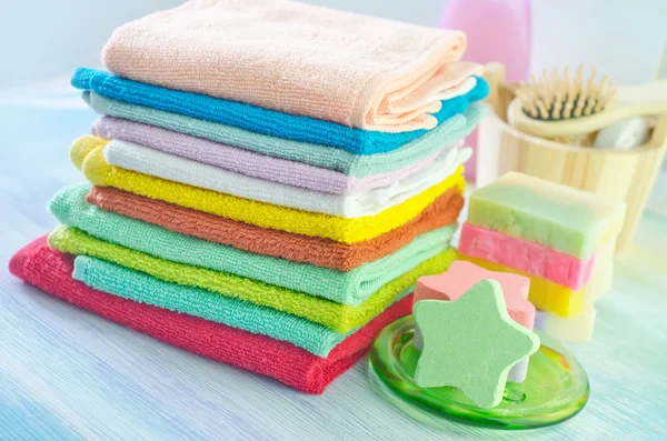 Assortment of soap and towels — Stock Photo, Image