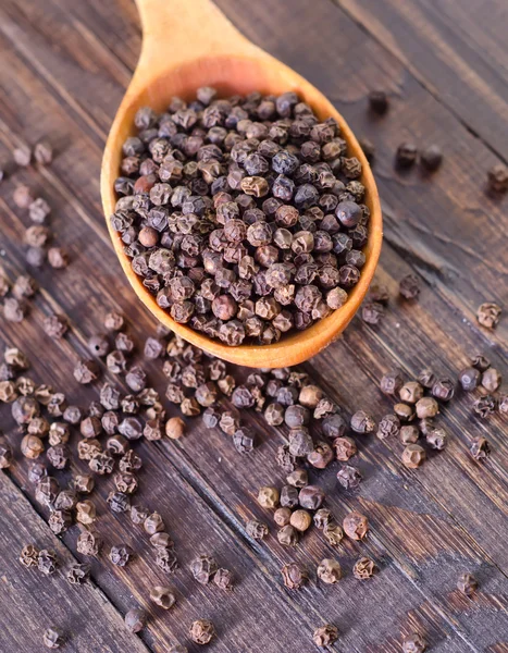 Pepper in spoon — Stock Photo, Image