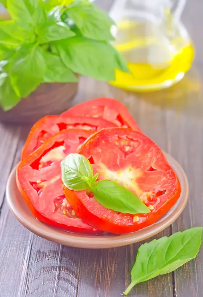 Tomato with basil — Stock Photo, Image