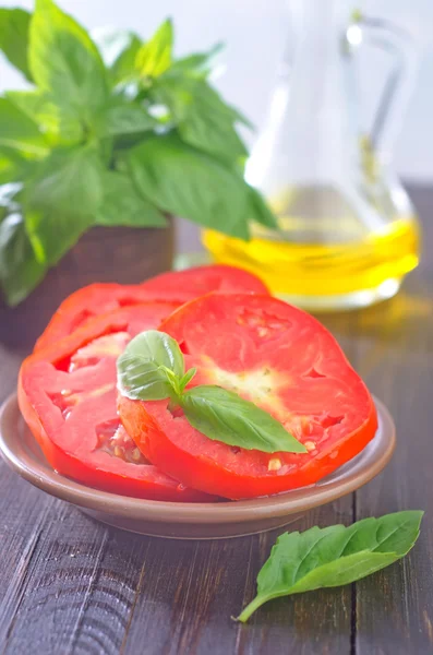 Tomato with basil — Stock Photo, Image